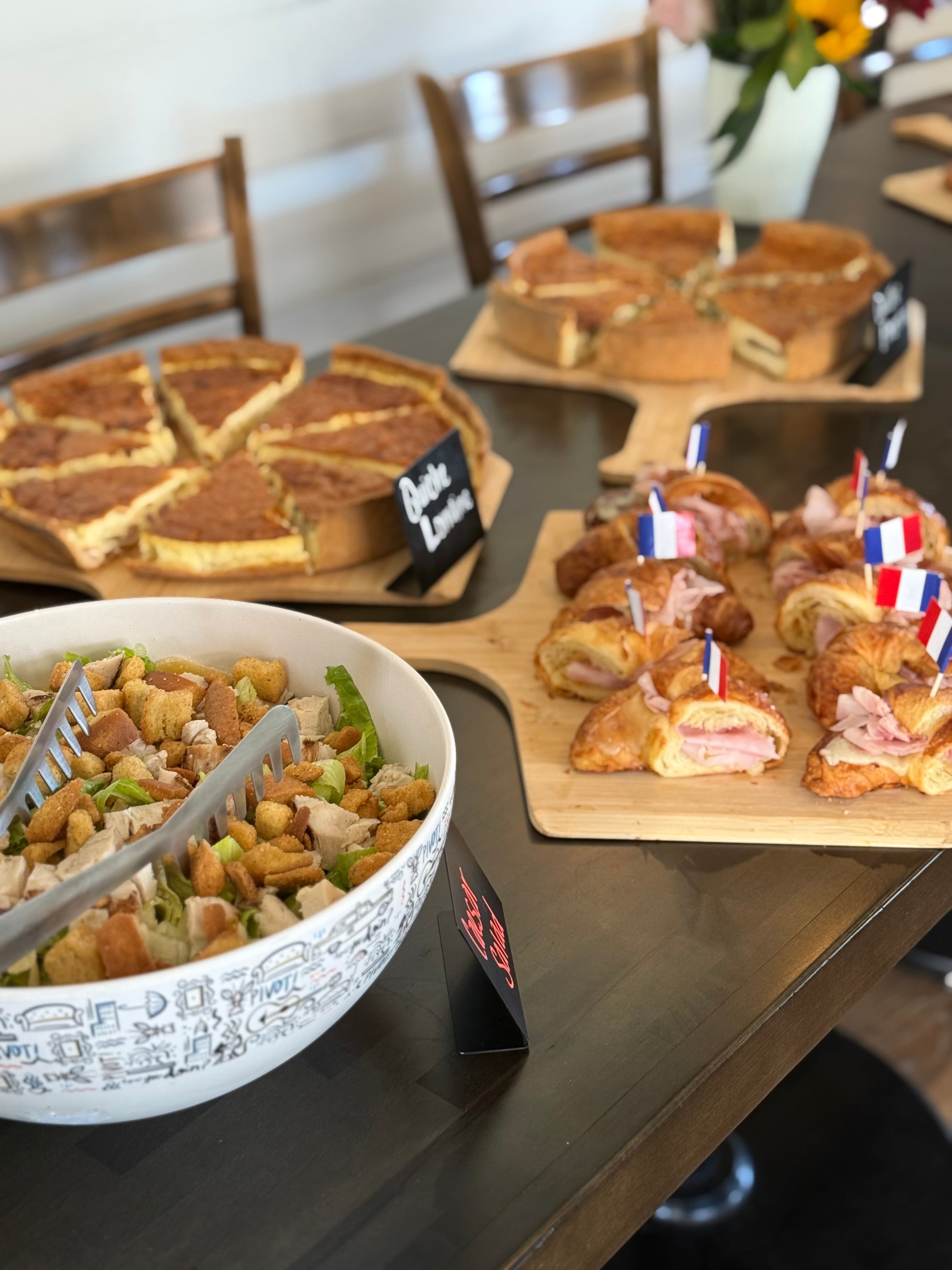 Quiche and croissant catering spread